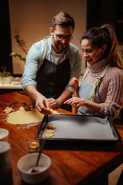 istock Couple enjoying baking together in cozy kitchen 2204807930