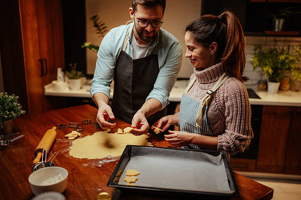istock Couple enjoying baking together in cozy kitchen 2204807939