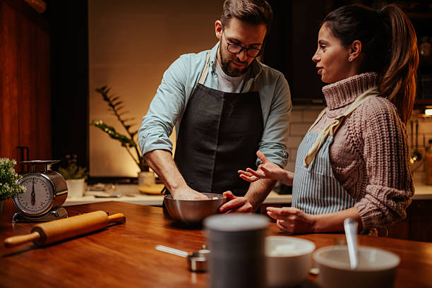 istock Couple enjoying baking together in cozy kitchen 2204807961