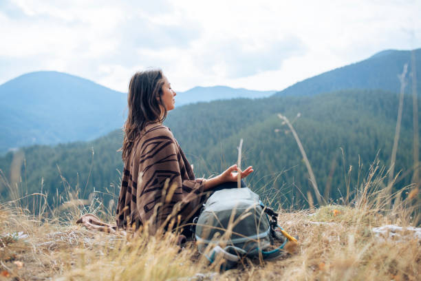 istock Meditation on a beautiful and peaceful spot in nature. 2204809999