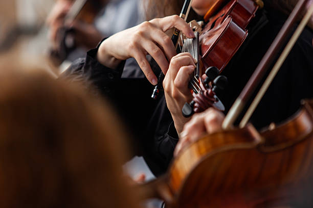 istock Violin in the hands of a musician 2204810413