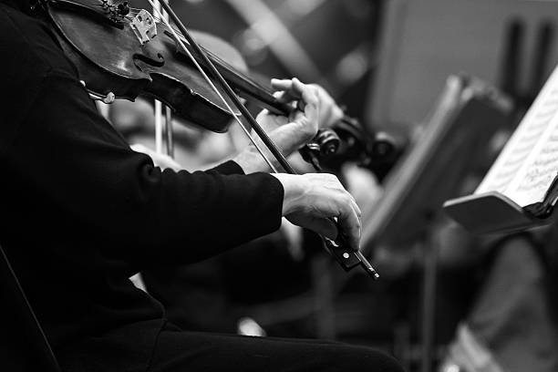 istock Hands of a musician playing the violin 2204810610