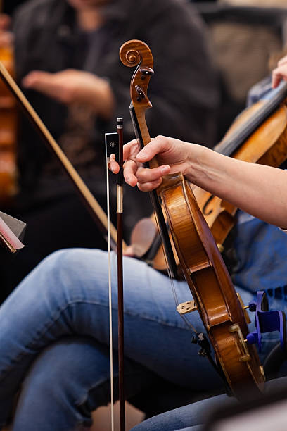 istock Violin in the hands of a musician 2204810613