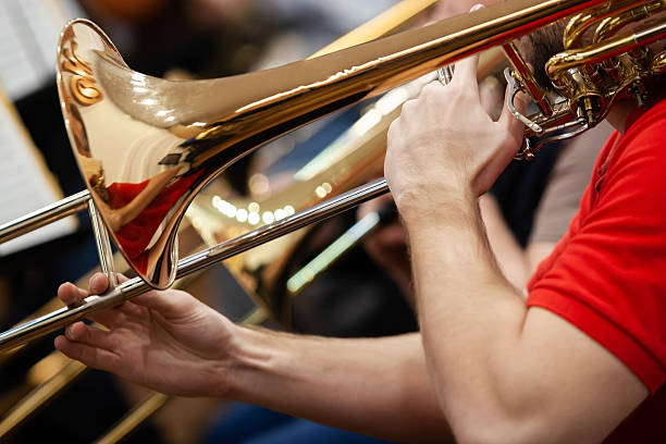 istock Hands of a musician playing a trombone 2204810624