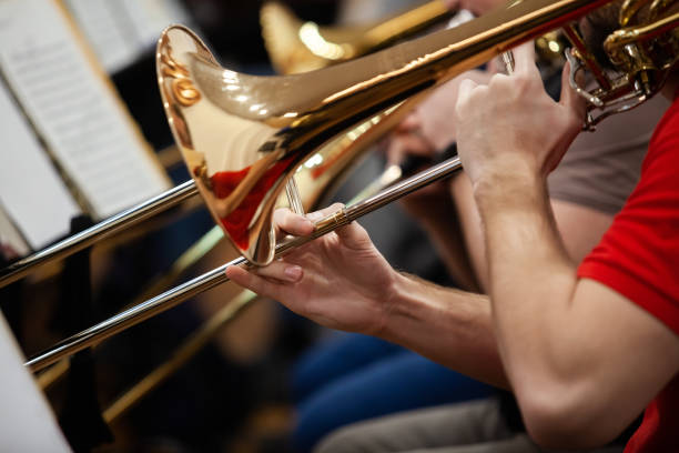 istock Hands of a musician playing a trombone 2204810647