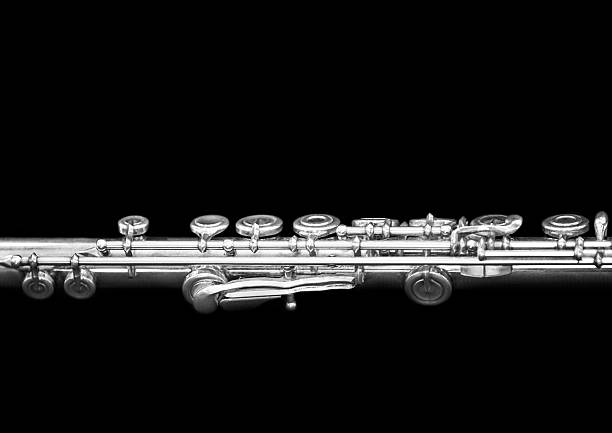 Fragment of a flute on a black background