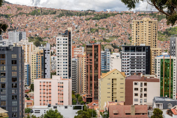 Panorama of La Paz cityscape filled with modern skyscrapers against mountainous backdrop. Vibrant urban scene showcasing architectural variety. Bustling city in mountainous terrain.