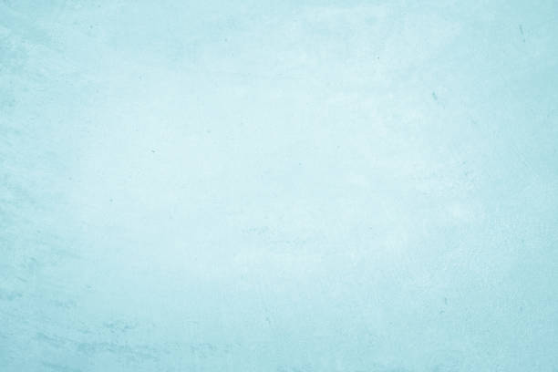Pastel blue and white concrete stone texture for background in summer wallpaper. Cement and sand wall of tone vintage. Concrete abstract wall of light cyan color, cement texture mint green for design.