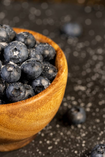 istock sprinkled with white sweet sugar juicy blueberry berries 2204823627