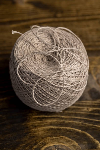 istock a new skein of grey thread is used for sewing 2204823778