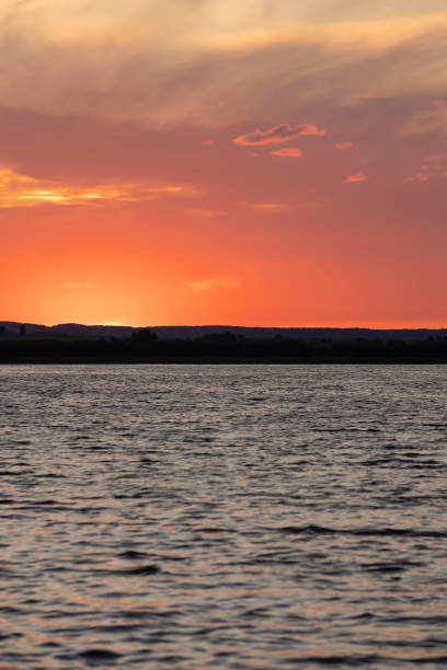 istock beautiful bright sunset on the lake in the summer 2204823989