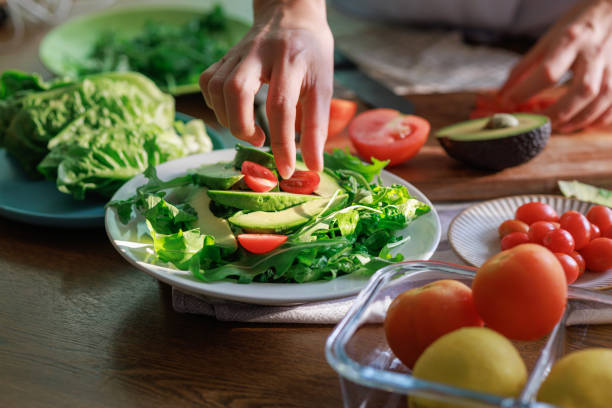 istock Healthy Avocado and Tomato Salad Preparation 2204824840
