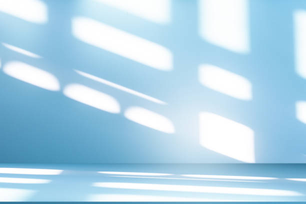 istock Studio style background wall decoration presentation uses white and blue tones. with shadows cast from a nearby window, concept creating a decorative 2204824905
