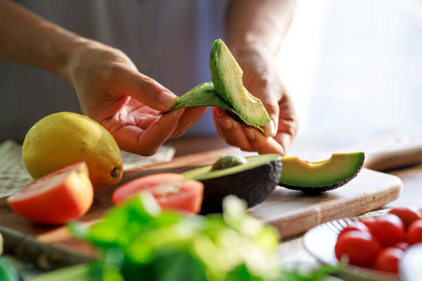 Peeling a Fresh Avocado for a Healthy Meal Preparation