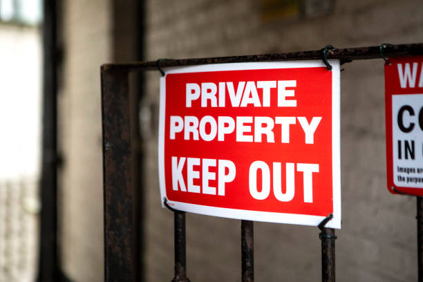 istock Red keep out notice on metal railings 2204828805