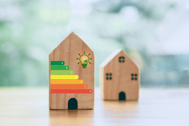 istock For house energy efficiency, eco home renovation save cost. Low consumption ecological house, Sustainable Development Concept, house with energy efficiency scale on blurred background 2204829062