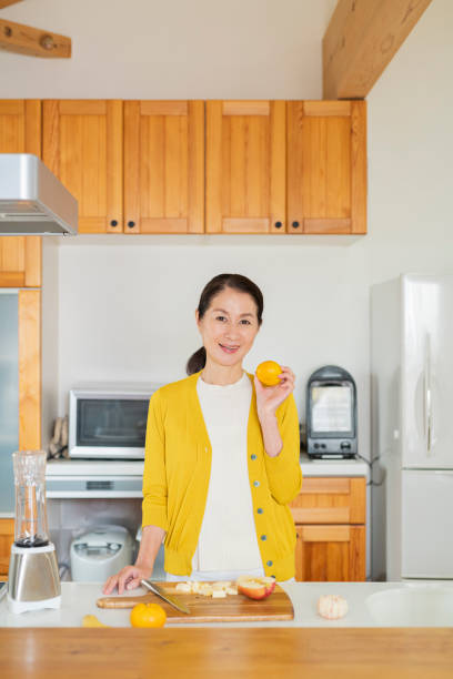 istock Senior woman in the kitchen 2204830013