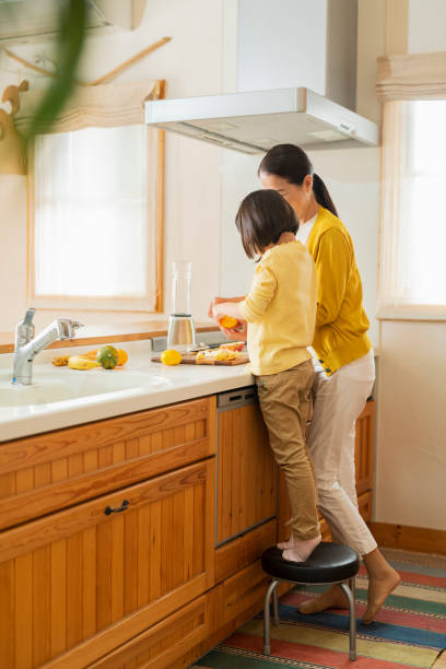 Grandmother and grandson cooking together