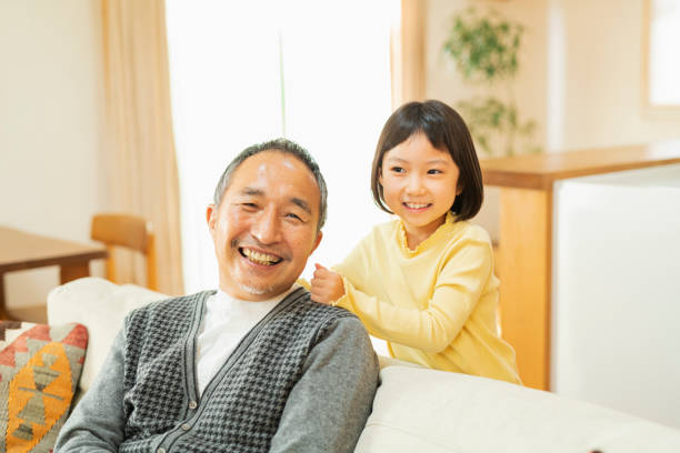 istock A grandchild playing with his grandfather 2204833714