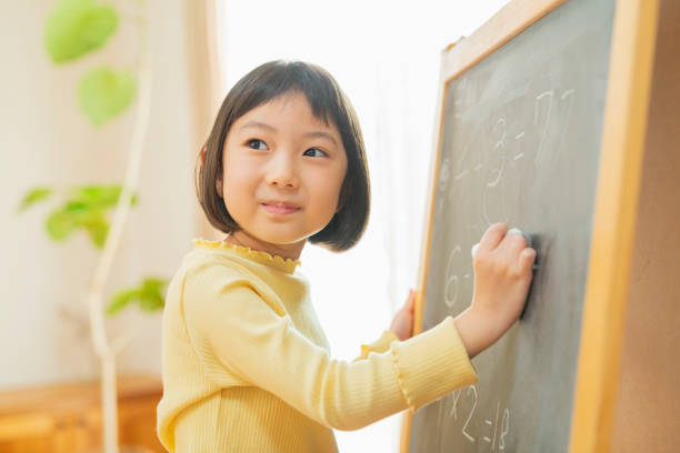 istock Grandchild studying in the living room 2204835725