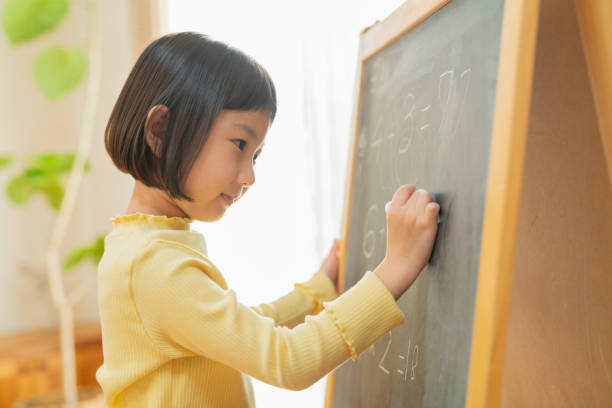 istock Grandchild studying in the living room 2204835771