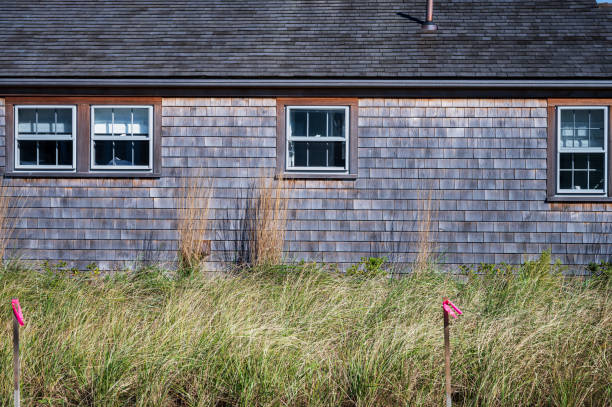 istock Shingles on the family home facade, Classic Cape Cod Architecture 2204837125