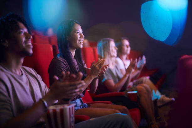 istock Applauding after a movie at cinema! 2204837347