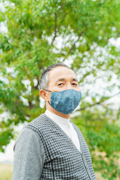 istock Senior man wearing a mask 2204838003