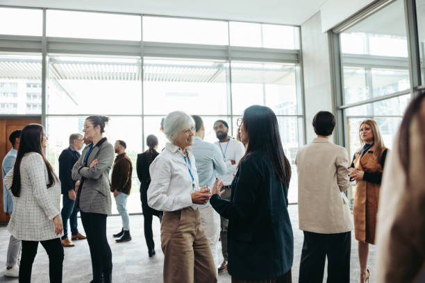 istock Diverse professionals networking at a business event in a modern office building 2204842881