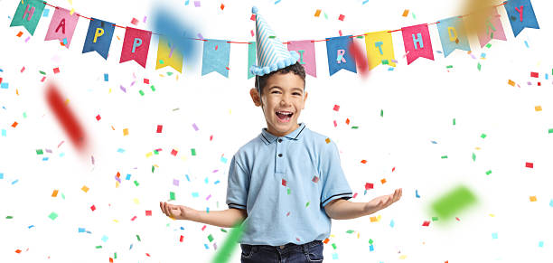 Excuted birthday boy with a party hat and confetti isolated on white background