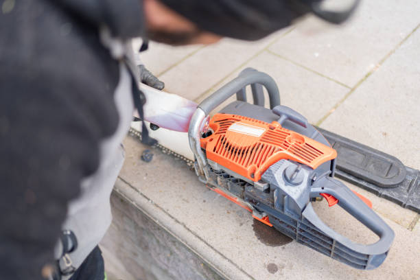 Unrecognizable man turning on chainsaw