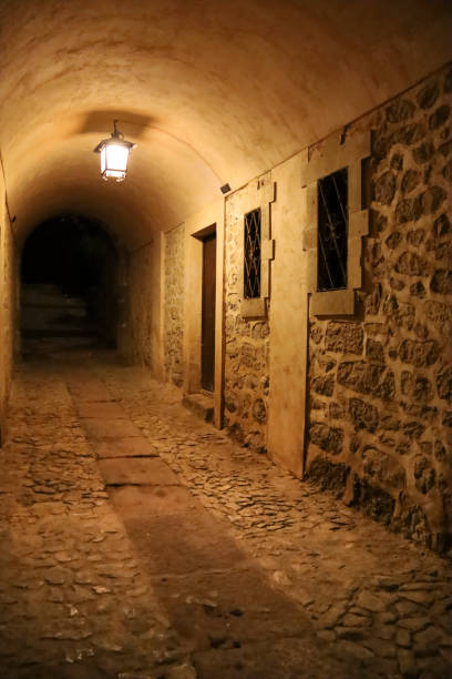 istock Narrow passageway at night in Albarracin town 2204848653