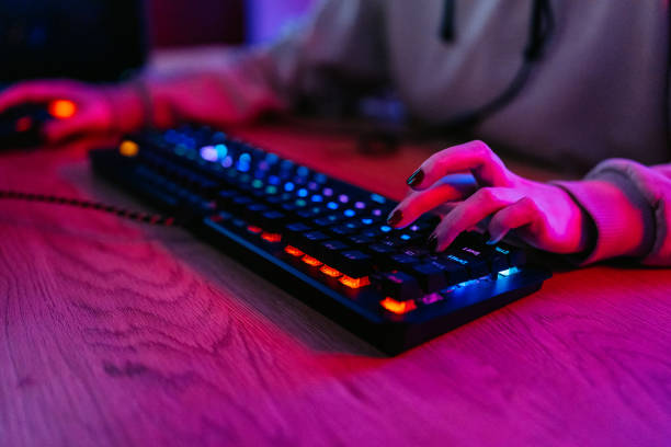 istock Young Woman Playing A Video Game On Her Desktop PC 2204848960