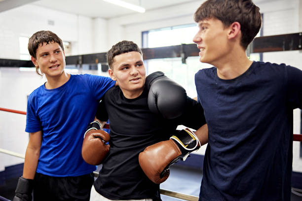 istock Teenage boxing mates interacting after training 2204850137
