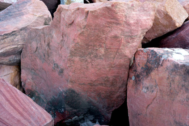Textured rocks reveal stunning colors under the warm sunlight.