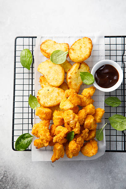 istock Chicken nuggets and potato hashbrowns 2204851771