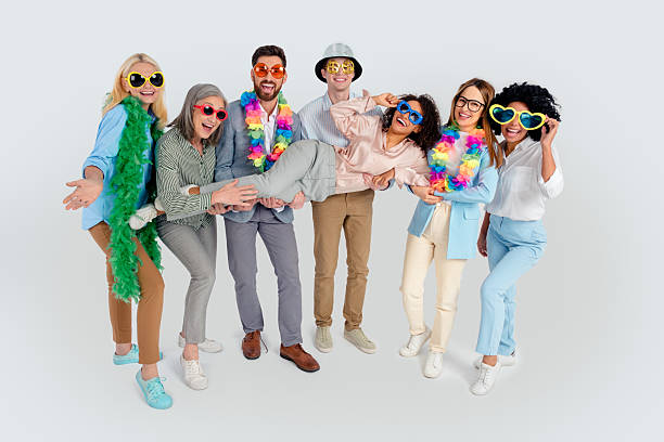 istock Group of diverse professionals in colorful attire posing joyfully in an office setting 2204851851