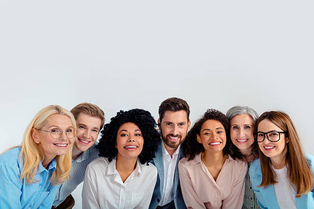 istock Diverse group of professionals smiling in a friendly office environment 2204851889