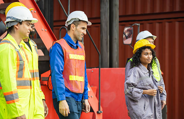 istock Logistics manager and engineers foreman workers team at shipping container yard, Diverse team of workers at cargo 2204852319