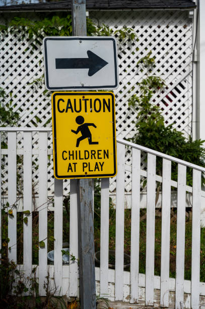 istock Caution Children at Play Road Sign 2204854445
