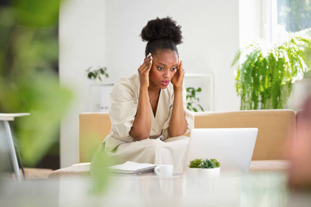 istock Worried young woman in the office 2204854875