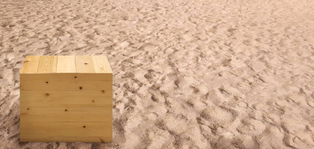 Empty wooden box on the beach with sunlight.