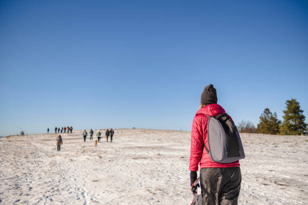 istock A long hike in the snowy mountains with friends 2204860773