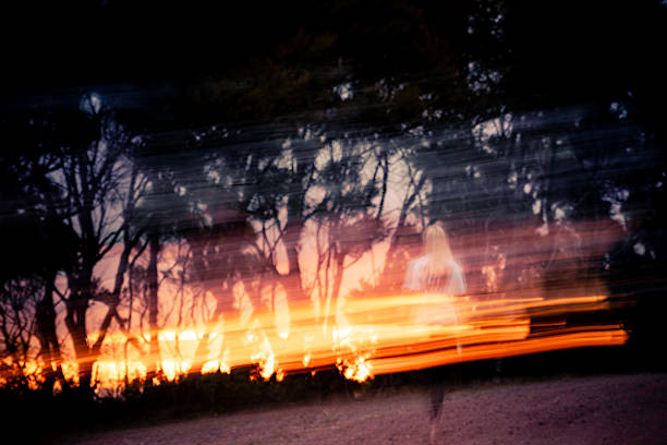 Long exposure of a confident woman walking alone on a dirt path