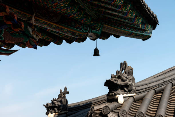 istock bell and rooftop with dragon sculpture 2204862373