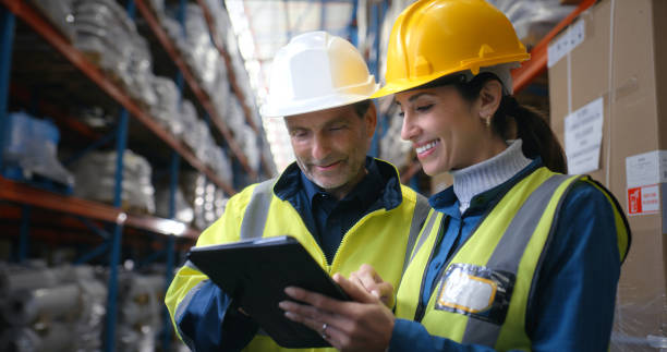 istock Teamwork, man and woman in warehouse with tablet, coordination and distribution. Logistics, manager and digital checklist in storage facility for delivery, quality control or shipping in supply chain 2204864049