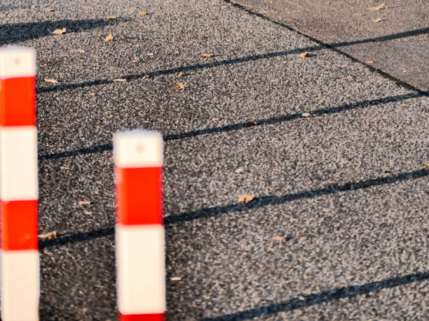 istock Long shadows behind the road bollards 2204864280