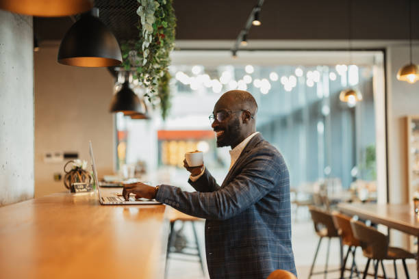 istock Happy professional enjoying coffee and laptop work 2204864687