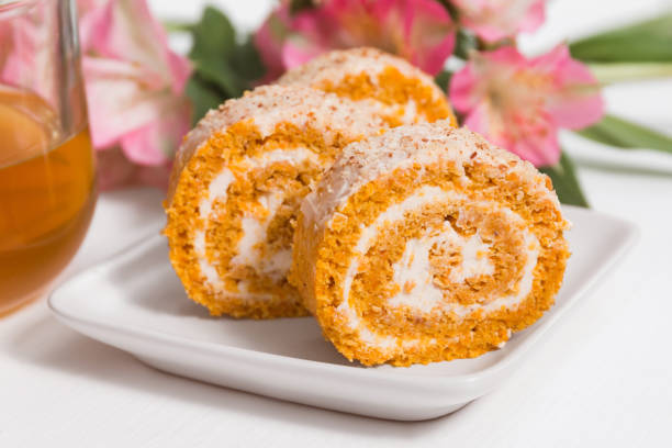 Pumpkin and carrot roll in close up. Healthy dessert