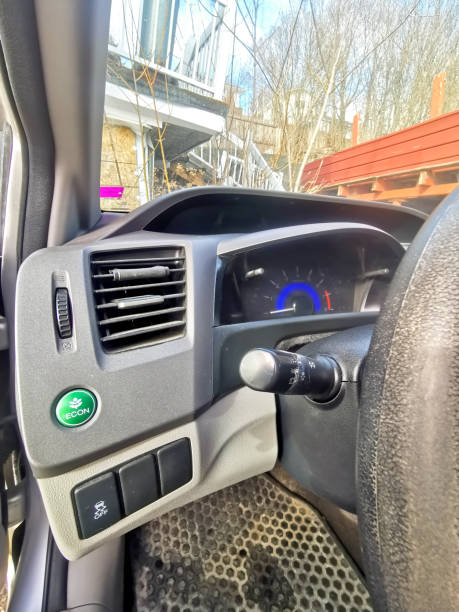 istock Close-Up of a Car Dashboard with Instrument Cluster and Eco Mode Button 2204868205